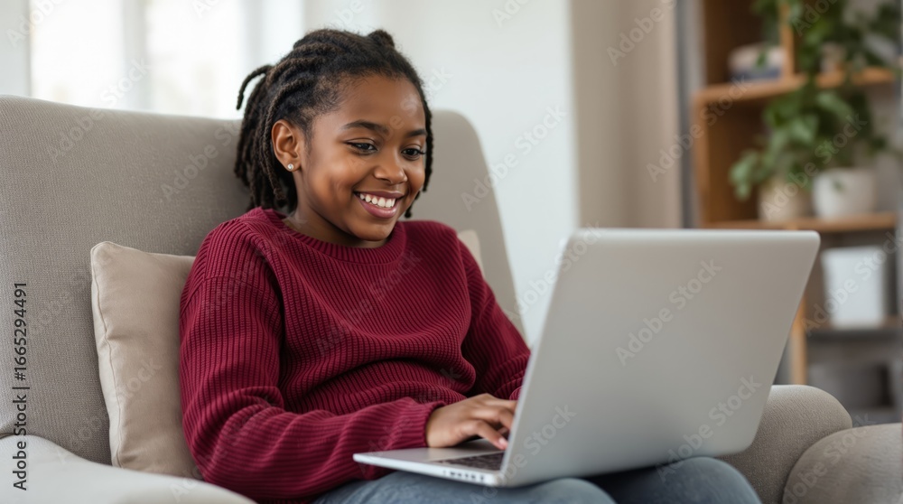 Naklejka premium Girl is using laptop