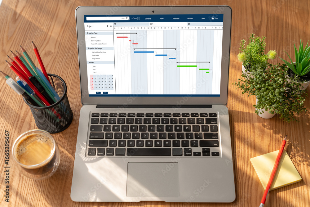 Fototapeta premium Project planning software for modish business project management on the computer screen showing timeline chart of the team project