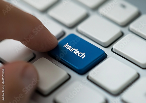 Finger pressing insurtech button on keyboard representing technological advances