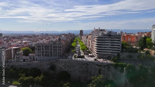 Dynamic drone video of Tarragona, Spain. Aerial view of popular Balcó del Mediterrani observation point and La Rambla Nova pedestrian promenade street.