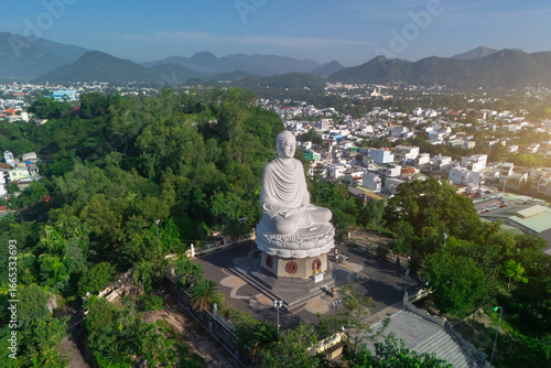 Canvas Print Big Buddha statue at the Long Son Pagoda or Chua Long Son, a Buddhist temple in
