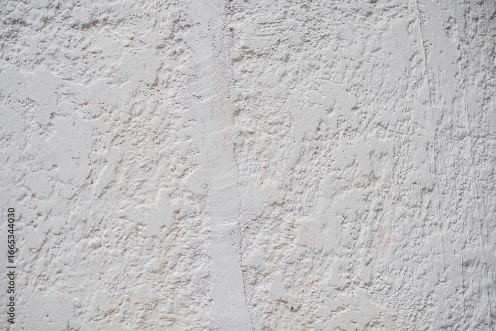 Obraz premium Textura de pared blanca rugosa con acabado irregular de yeso