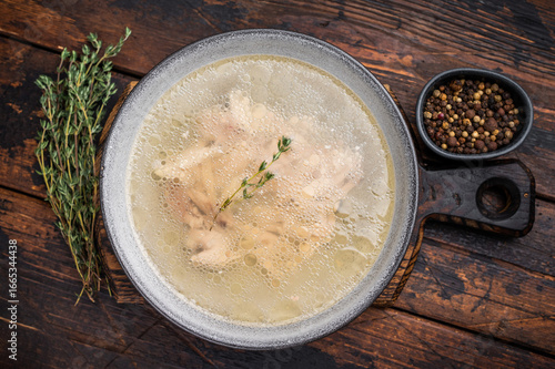 Fotografie Bowl of clear chicken broth with meat