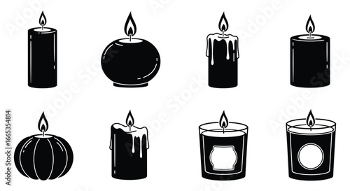A collection of black candles in various shapes and sizes with flames
