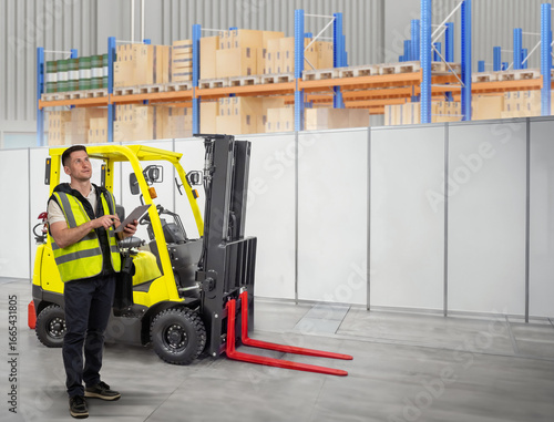 Man forklift driver standin...