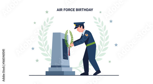 An Air Force soldier places a memorial wreath on a monument to celebrate the Air Force Birthday.