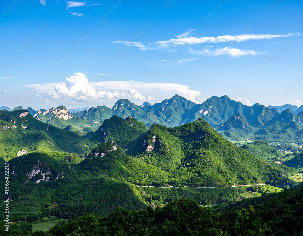 Obraz premium Lush mountain range under a vast blue sky