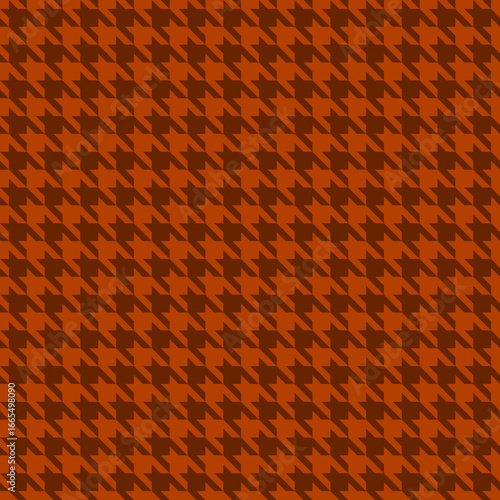 A sophisticated, seamless houndstooth pattern in rich burnt orange and deep brown.  This classic textile design offers endless versatility, perfect for backgrounds, fashion, and branding.