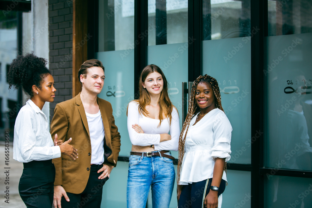 Obraz premium Portrait of creative marketing team of young diverse professionals standing together outdoors, showing confidence, teamwork, leadership, and collaboration in modern business environment