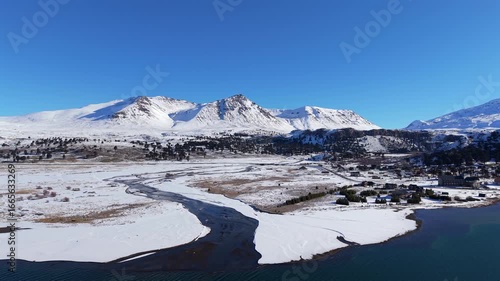Wallpaper Mural Aerial view of snowy Caviahue landscape with Andes mountains and frozen river, Neuquen, Argentina Torontodigital.ca
