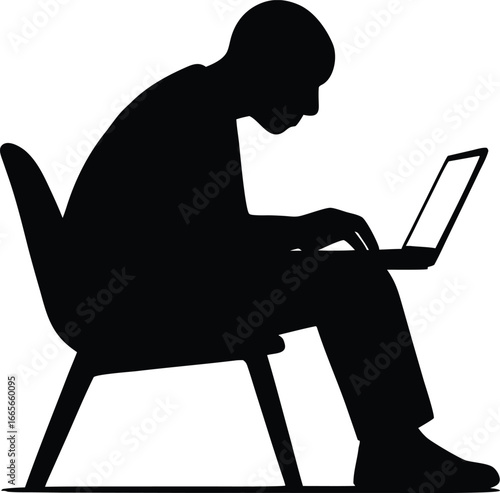  working intently on a laptop computer