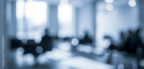 Wallpaper Mural Blurred office interior with people sitting at desks in a blue tone, giving a modern corporate atmosphere that suggests teamwork, productivity, and creative collaboration. Torontodigital.ca