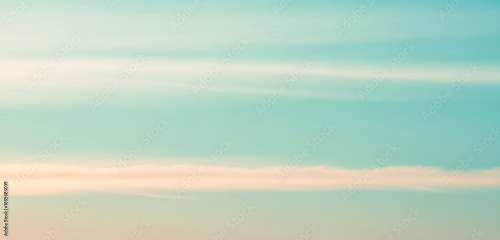 Fototapeta premium Abstract blurred background with teal blue and light beige colors, creating a soft dreamy atmosphere that feels calm and natural with smooth gradient tones.