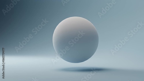 Soft light illuminates a smooth, white sphere floating on a light blue backdrop