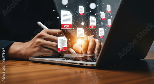 Man digitally signs PDF documents on laptop using stylus for electronic signatures