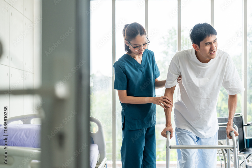 Fototapeta premium Physical therapy. Female Nurse aids young man in recovering from spine injury and providing orthopedic massage Orthopedic healthcare and chiropractor with person for physical therapy rehabilitation