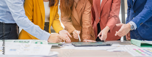 Business meeting showcases agile brainstorming with data analysis charts on tablets. Financial growth prediction strategy through predictive analytics and data-driven insights for strategic business 