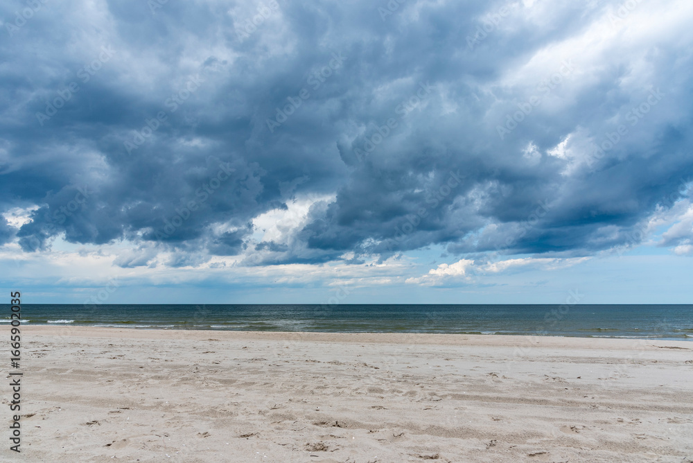 Fototapeta premium Cloudy, dramatic sky over a Polish beach near Sopot.