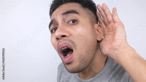 Man Expressing Shock and Disbelief with Open Mouth and Raised Eyebrow.