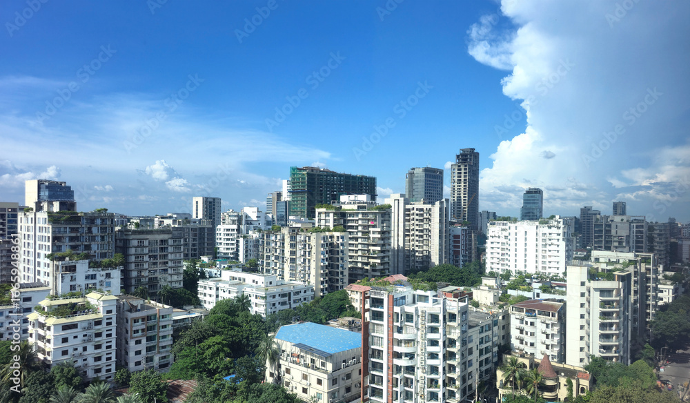 Obraz premium city skyline with modern buildings and clear blue sky, urban architecture and cityscape view of Bangladesh capital. High angle view of city residential and financial buildings at sunny day