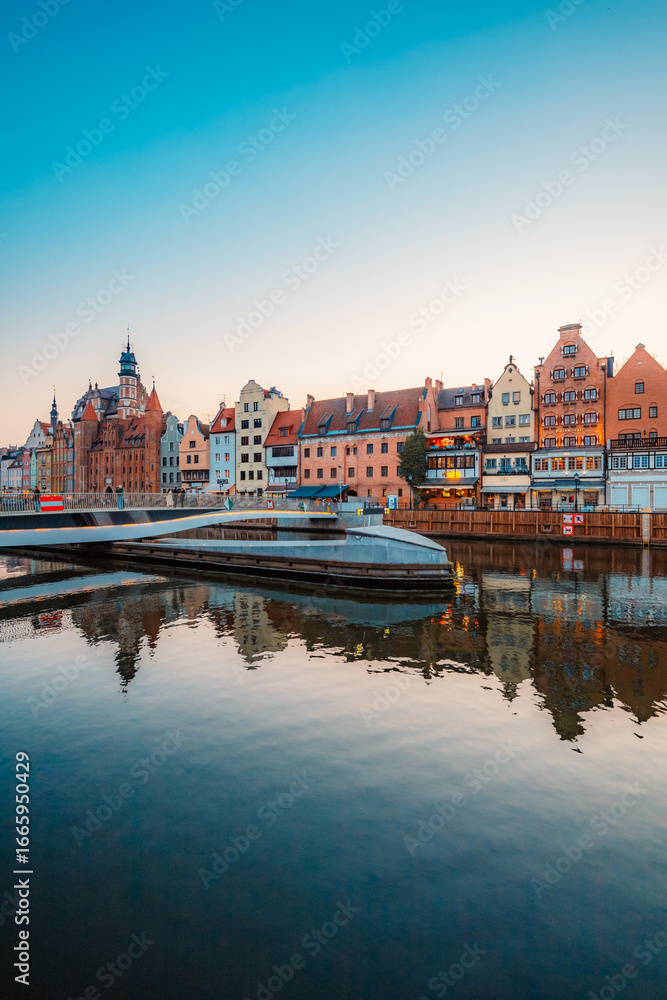 Obraz premium Gdansk with Motlawa river in Poland. Old town colourful house with Holy Spirit Gate
