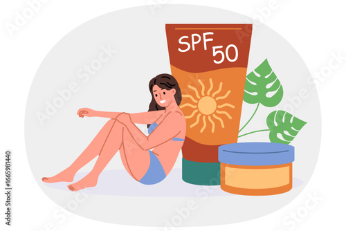 Woman uses SPF cream to prevent effects of ultraviolet radiation on skin, dressed in bikini to visit beach. SPF 50 gel for protection from direct sunlight and excessive tanning that worsens health