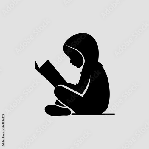 child reading book silhouette