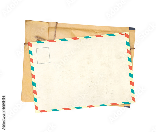 Top view of vintage paper envelope and retro postcard with striped edges. Nostalgic scrapbooking template is perfect way to express creativity and evoke a sense of warm memories. Isolated on white