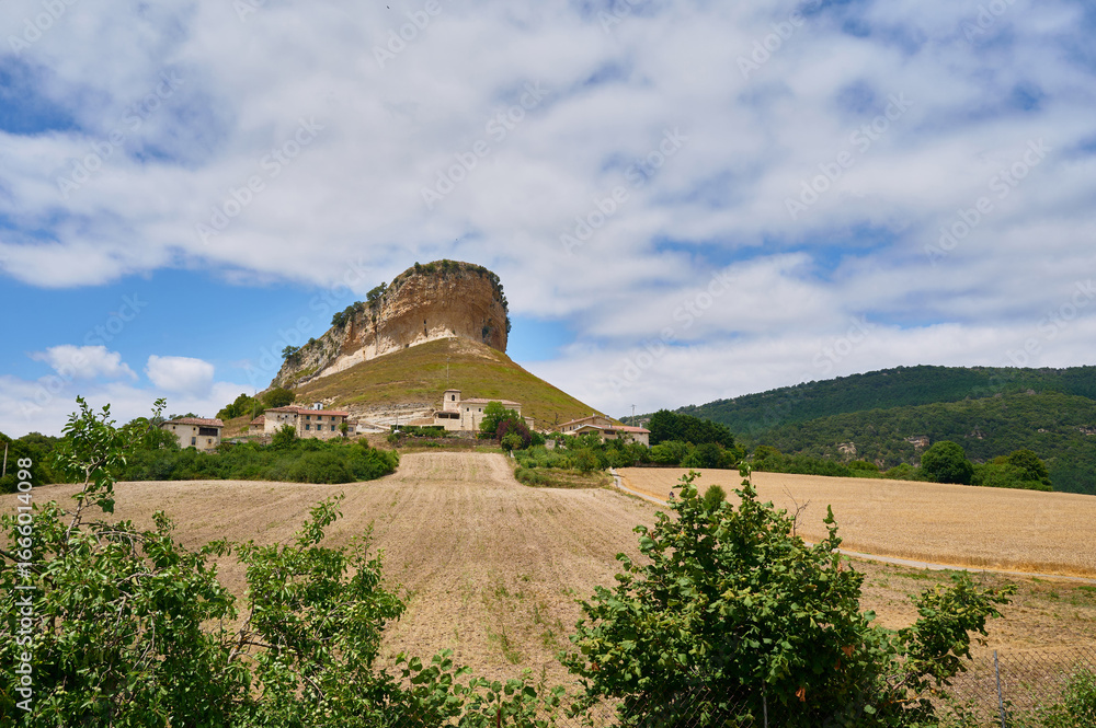 Picturesque spanish village nestled at the foot of a majestic cliff in the San Pantaleón de Losa, Burgos, Picturesque spanish village nestled at the foot of a majestic cliff in the San Pantaleón de Losa, Burgos,