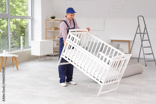 Loader moving baby crib in ...