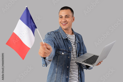 Young man with flag of Fran...
