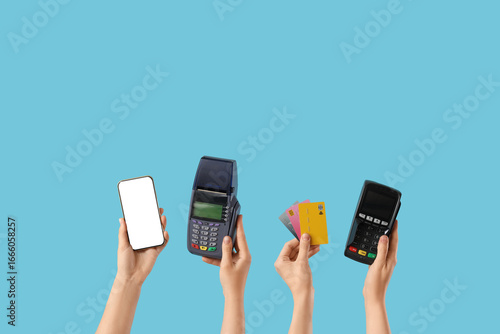 Hands holding payment termi...