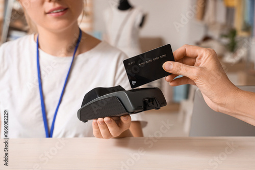 Female seller receiving pay...