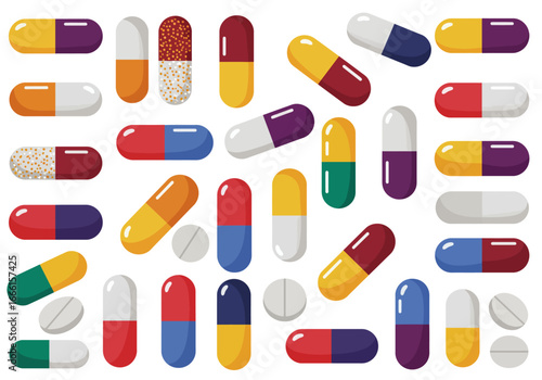 Multicolored pills and tablets are scattered across a white surface