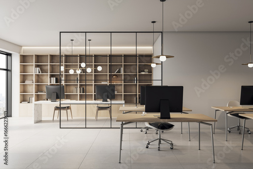 Papier peint Modern luxury office interior with wooden desks, glass partition, computers, and bookshelf wall in corporate workspace environment