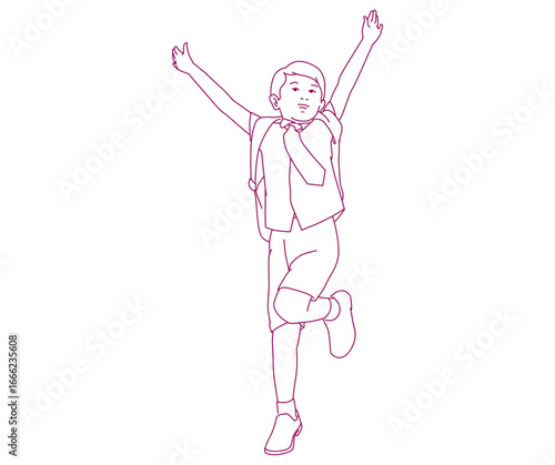 Happy schoolboy jumping