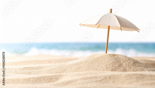 Seaside Serenity: An idyllic scene unfolds on the sandy shores, where a miniature parasol stands guard over a small dune.