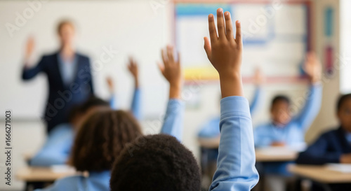 Student of Color Confidently Raising Hand in Classroom