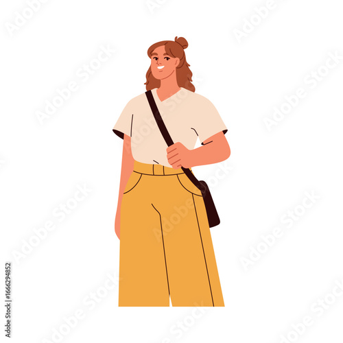 Woman standing with shoulder bag