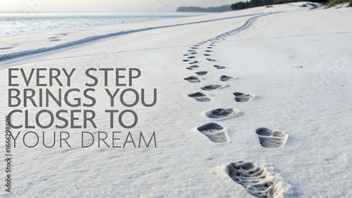 Footprints on a Sandy Beach with Motivational Quote for Inspiration