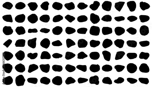 Black and white rocks arranged in a striking pattern resemble smooth rocks in silhouette. The minimalist design contrasts sharply against the white background, creating a bold visual effect.