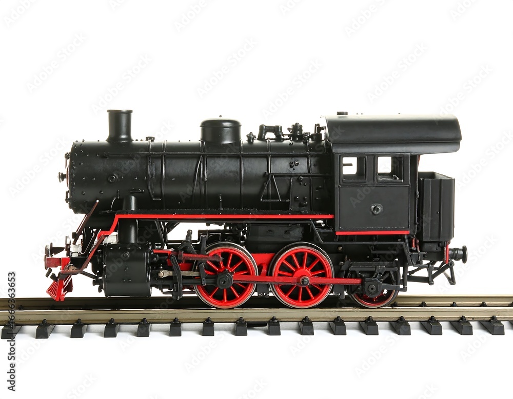 Naklejka premium Black Steam Locomotive Model on Track, Isolated White Background.