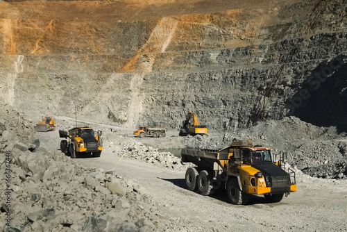 Dump trucks in gold ore quarry