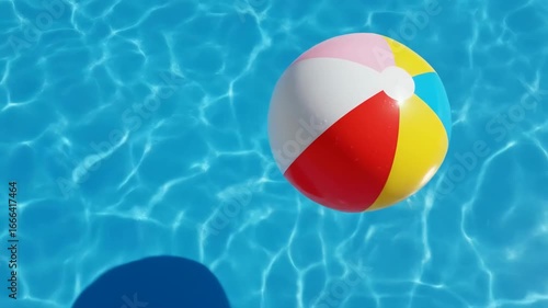 Vibrant Beach Ball Floating Serene Pool Water Surface Capturing Summer Fun and Recreation Perfectly