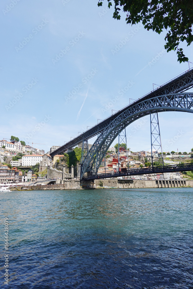 Fototapeta premium The view of Luis I bridge in Porto, Portugal., panorama opening from Vila Nova De Gaia