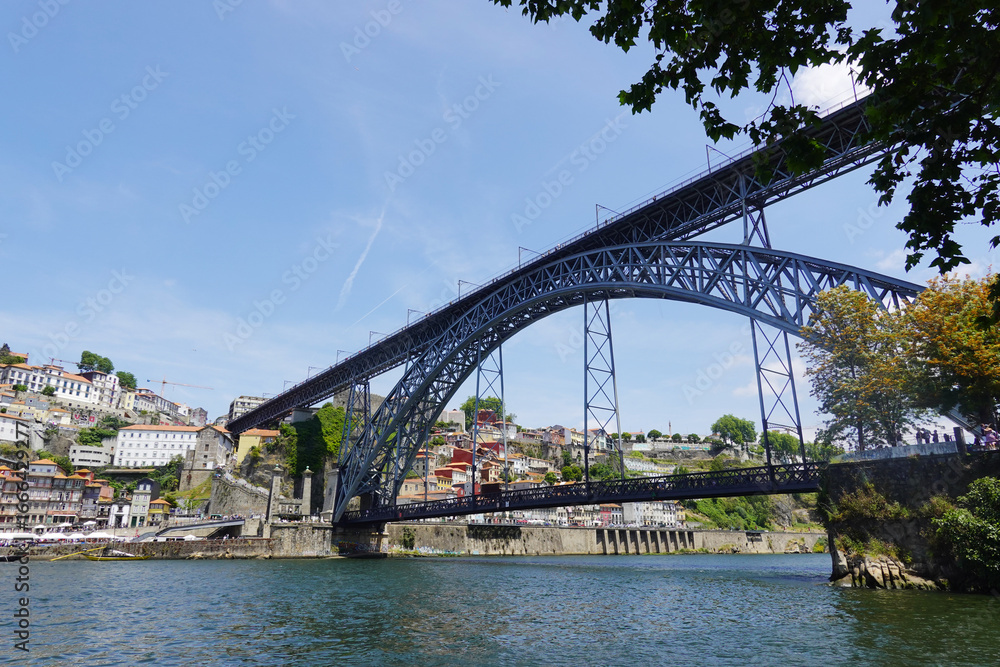 Obraz premium The view of Luis I bridge in Porto, Portugal., panorama opening from Vila Nova De Gaia