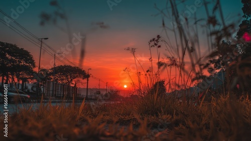 Fiery sunset over tranquil lake. AI image