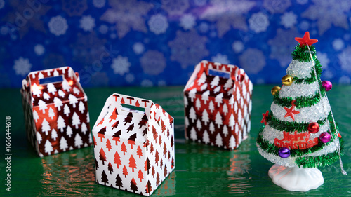 Gift boxes with a Christmas tree and a starry background