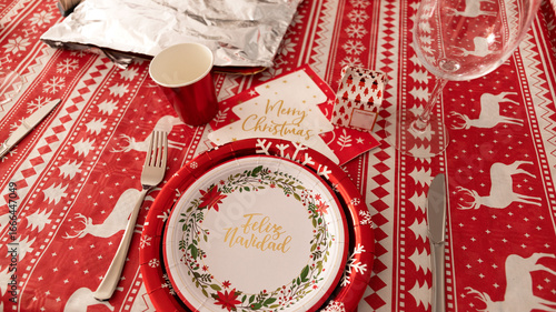 plates and tablecloth decorated with Christmas motifs
