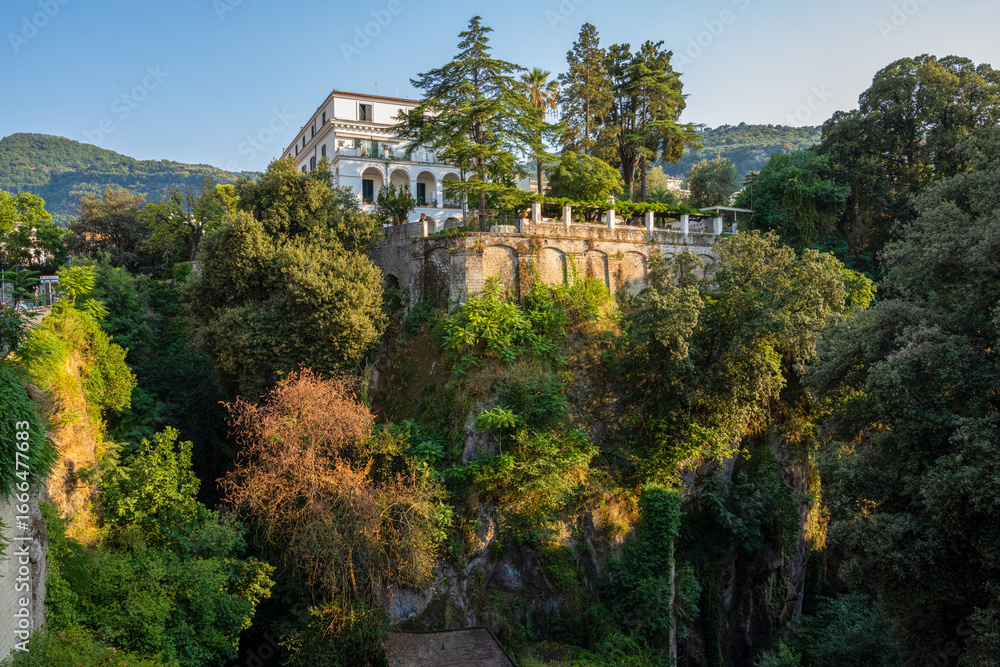 Obraz premium Italian Villa, Lush Greenery, Blue Sky.